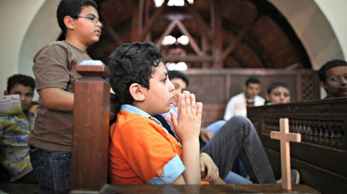 Image: Peter Macdiarmid / Getty Images Coptic children attend a religious class at The Hanging Church in Cairo, Egypt.