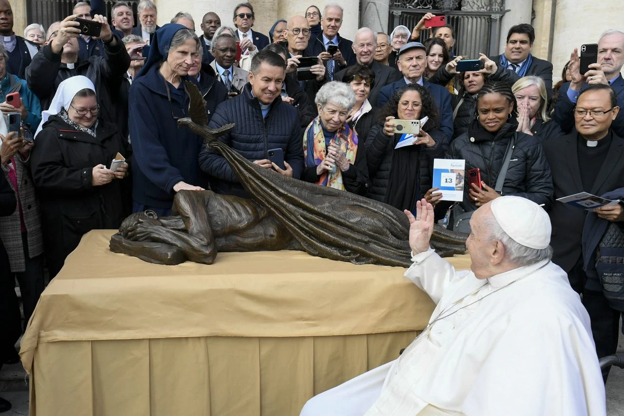 Pope Francis waves to members of Vincentian religious orders and lay communities on Wednesday, Nov. 9, 2022, after blessing Canadian artist Timothy Schmalz's new sculpture, "Sheltering." Photo by Vatican Media