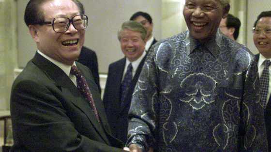 Late former Chinese president Jiang Zemin having a light moment with late former president Nelson Mandela. l FILE